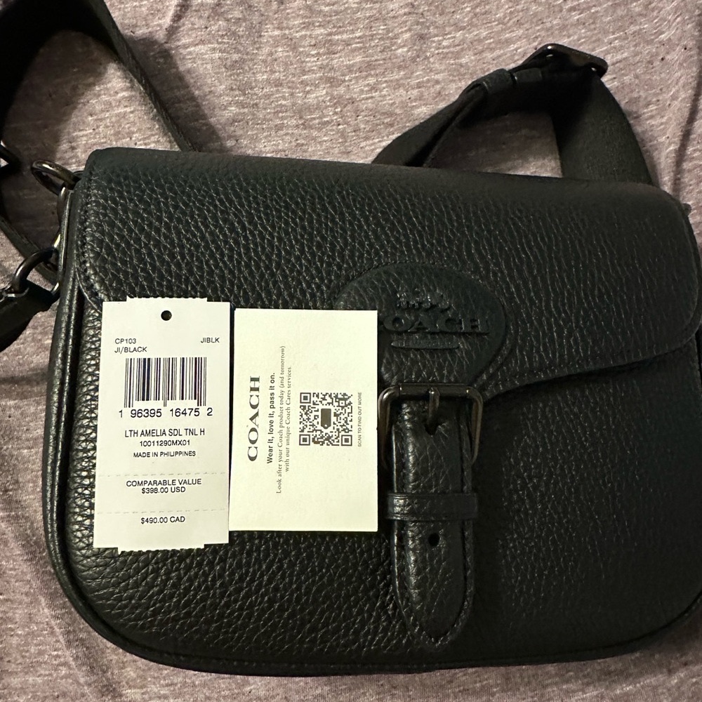NWT used one time Coach Amelia Saddle Bag Pebbled Leather/Black Copper/Black